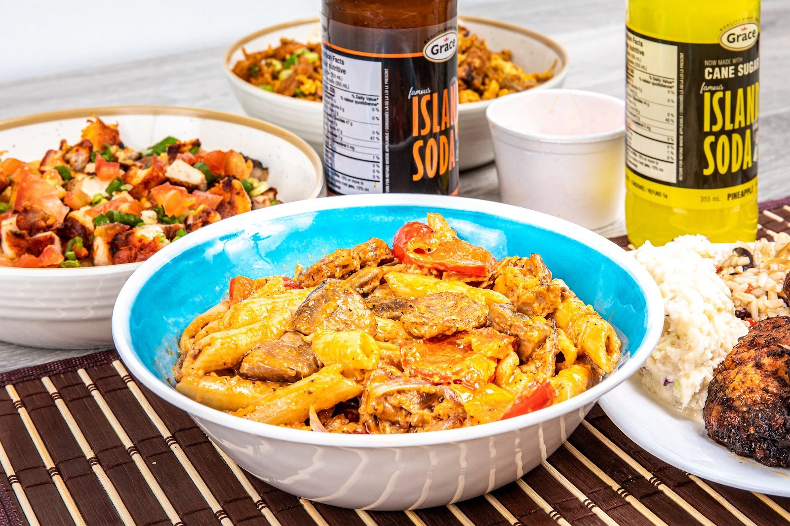 Jerk chicken with rice and peas, coleslaw and hot sauce at Spice Rack